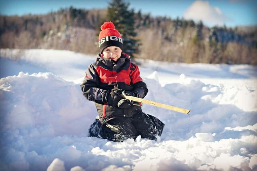 15 min. Tadoussac : Family-Friendly Ice Fishing Experience - Getting started with rods, bait, and drilled holes