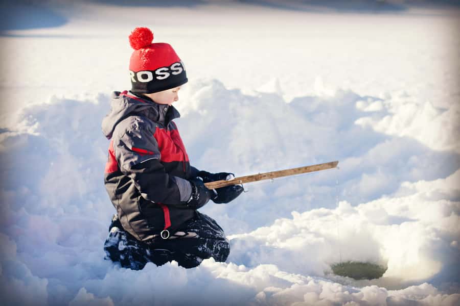 15 min. Tadoussac : Family-Friendly Ice Fishing Experience - Waiting beside a frozen pond