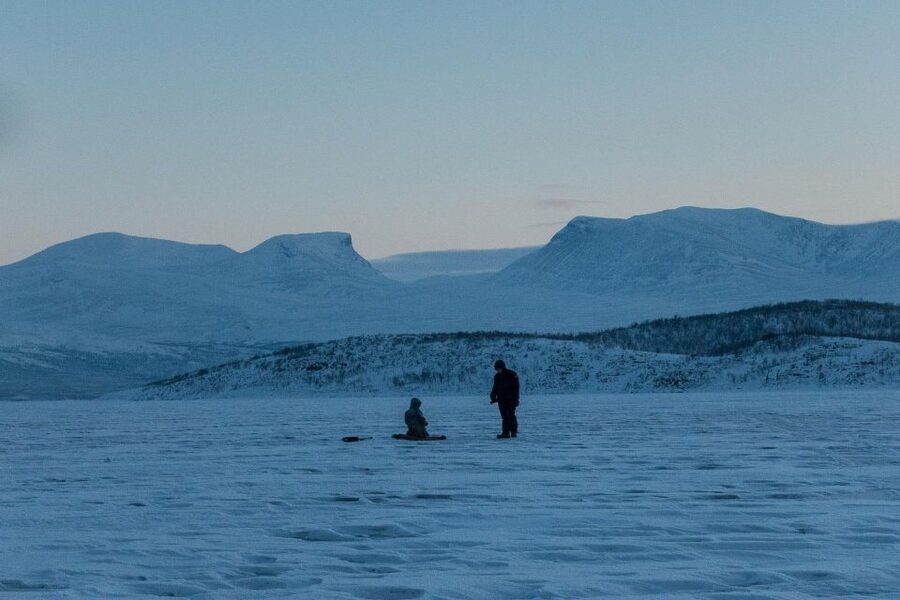 Abisko: Lake Torneträsk Arctic Ice Fishing Trip - Drilling the hole and learning the basics
