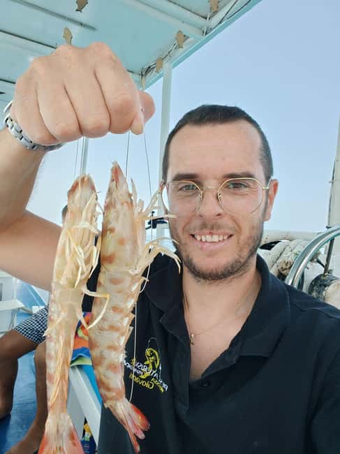 Cefalù: boat trip with fishing, coastal tour, snorkeling, and lunch on board - Meeting Giovanni at Cefalù’s port