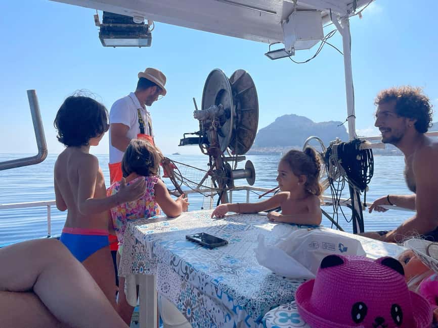 Cefalù: boat trip with fishing, coastal tour, snorkeling, and lunch on board - A swim and snorkel near Santa Lucia