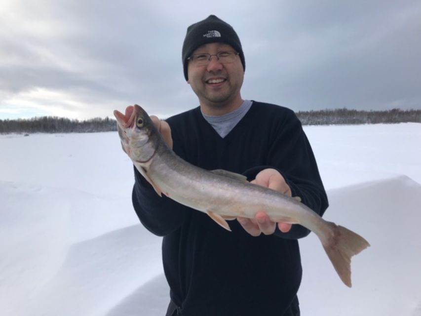 Chena Lake: Aurora Borealis Viewing & Ice Fishing Adventure - Getting set up inside the heated fishing cabin