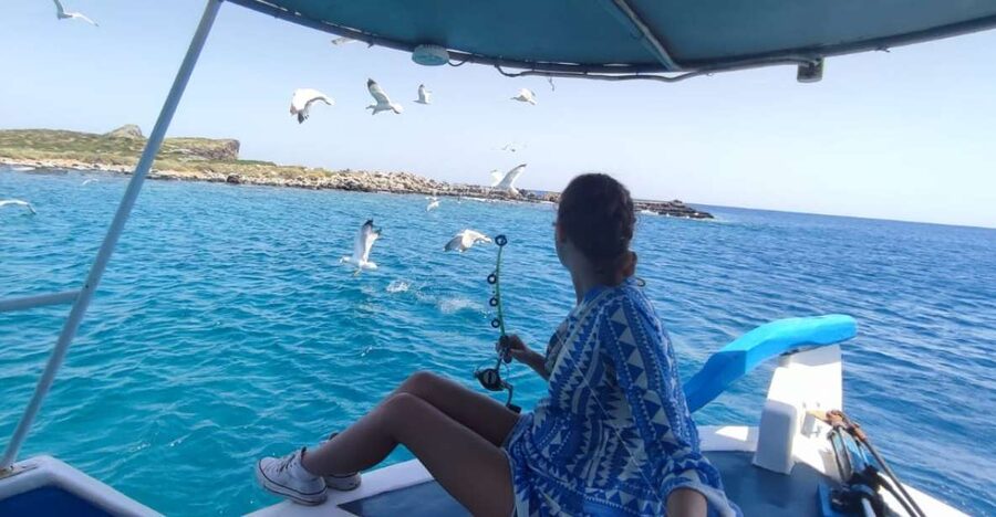 Crete: Fishing & Swimming Boat Cruise with Lunch & Drinks - Passing Spinalonga and fishing around the bay