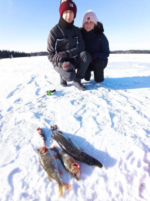 From Helsinki: Bodom Lake Ice Fishing with Food & Drinks - The laavu fire and Finnish winter food