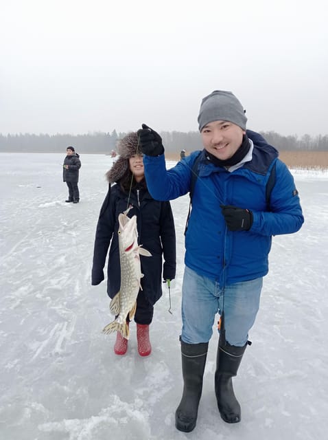 From Helsinki: Bodom Lake Ice Fishing with Food & Drinks - Walking across the ice to choose a fishing spot