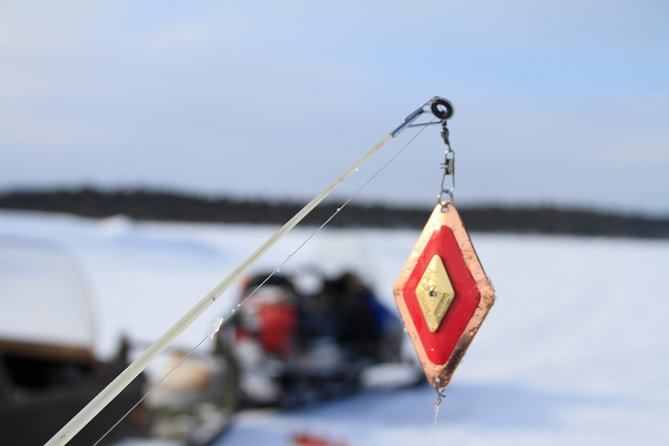 From Ivalo: Ice Fishing Safari to Lake Inari, reindeers & lunch - A sleigh ride that makes the transfer part of the day