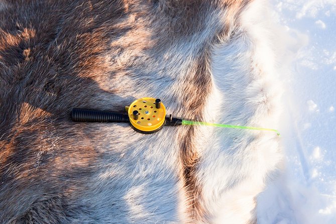 From Ivalo: Ice Fishing Safari to Lake Inari, reindeers & lunch - Lunch by an open fire in a Finnish tent