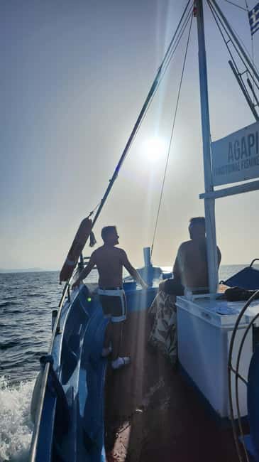 Hersonissos: Agapi Fishing Trips Sunset Cruise - Drinks, fruit salad, and the simple boat setup