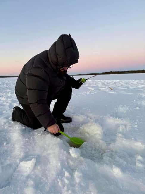 Ice Fishing Adventure in Levi with Salmon Soup - Reindeer and huskies near the fishing site