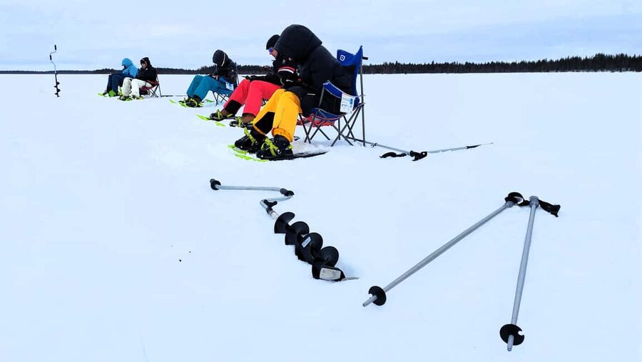 Ice Fishing Adventure in Levi with Salmon Soup - Drilling your first hole at Rautusjärvi
