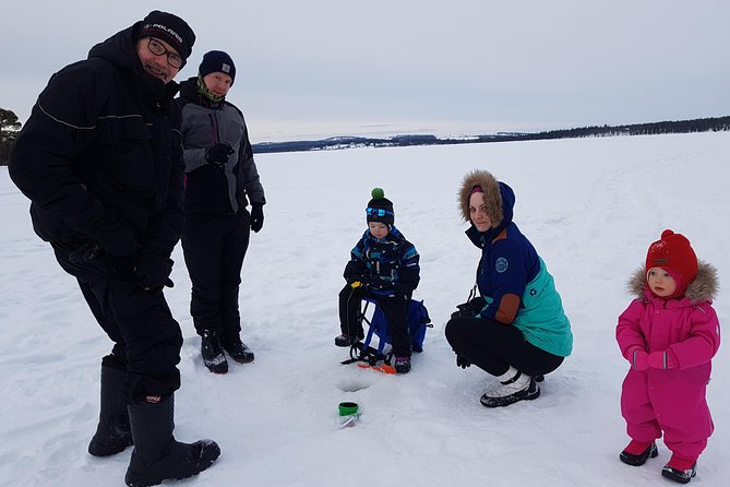 Ice fishing by car with hot beverages at Pyhä-Luosto - Drilling into a Finnish winter day