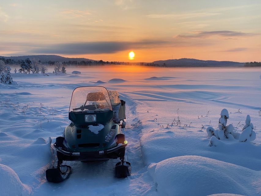 Icefishing and tasting in Lake Inari - Reaching frozen Lake Inari by snowmobile sleigh