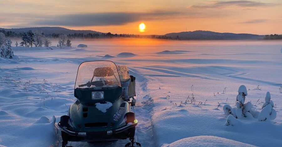 Icefishing and tasting in Lake Inari - A fire, hot berry drink, and fish from the lake