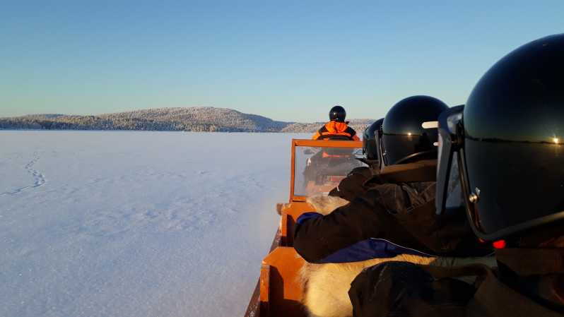 Ivalo: Ice Fishing Tour to Lake Inari, Reindeers & Lunch - Riding a sleigh across Lake Inari