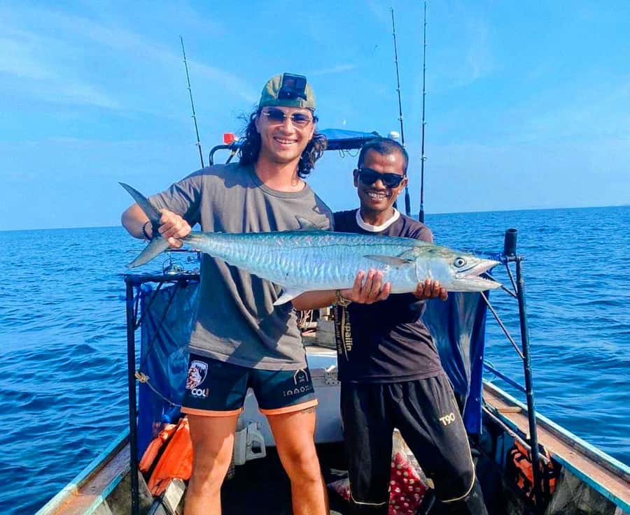 Ko Lanta: Exclusive Private Long-tail Boat Fishing Trip - A traditional long-tail boat, not a luxury charter