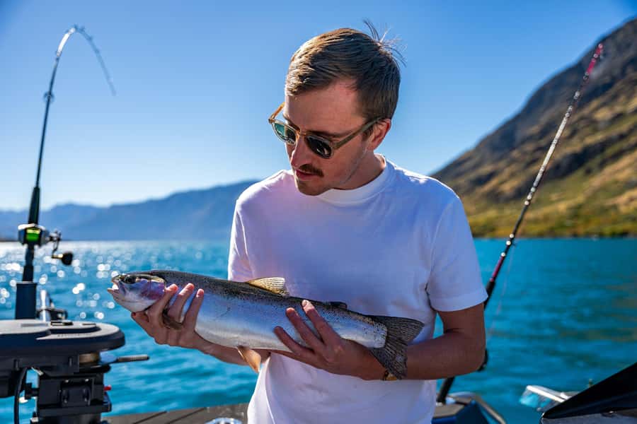 Lake Wakatipu: 3 Hour Fishing Adventure by Boat - Meeting the blue Catch a Fish boat