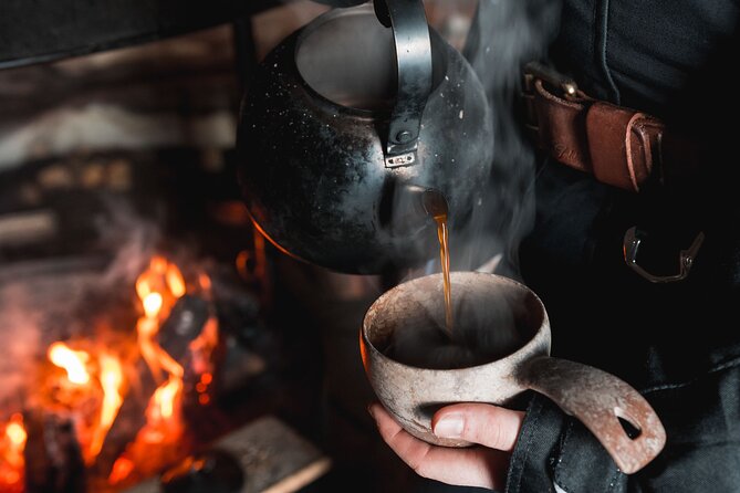 Lappish Lunch Break -Snowmobiling, ice fishing and tasty food - Reindeer soup, hot drinks, and a warm tent