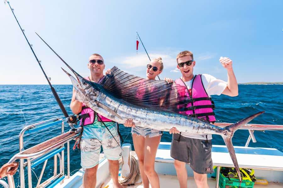 Phuket: Racha Island Fishing and Snorkeling Boat Tour - Starting at Chalong Pier and settling into the boat