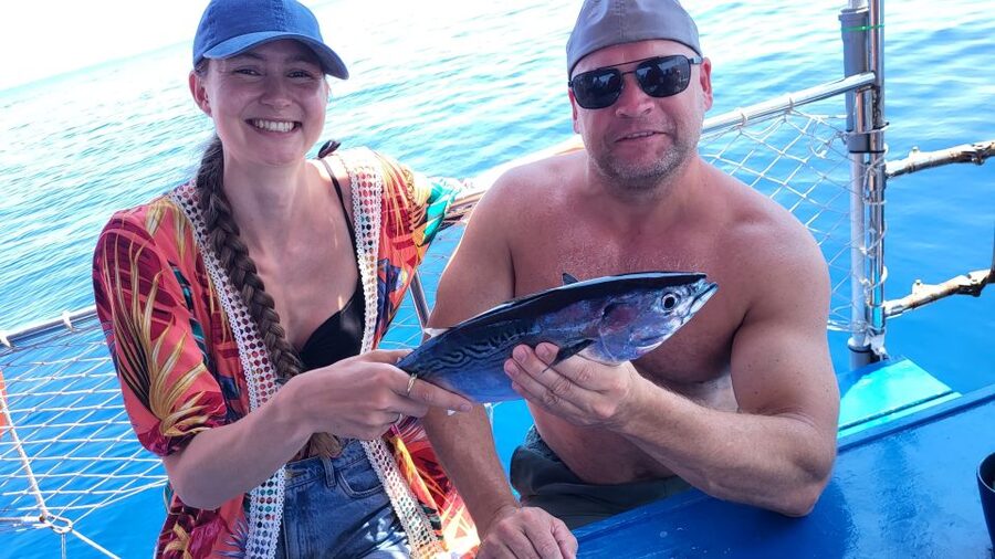 Rhodes: Fishing Trip, Snorkelling, BBQ, & Professional Guide - Fresh fish, Greek salad, and a family BBQ
