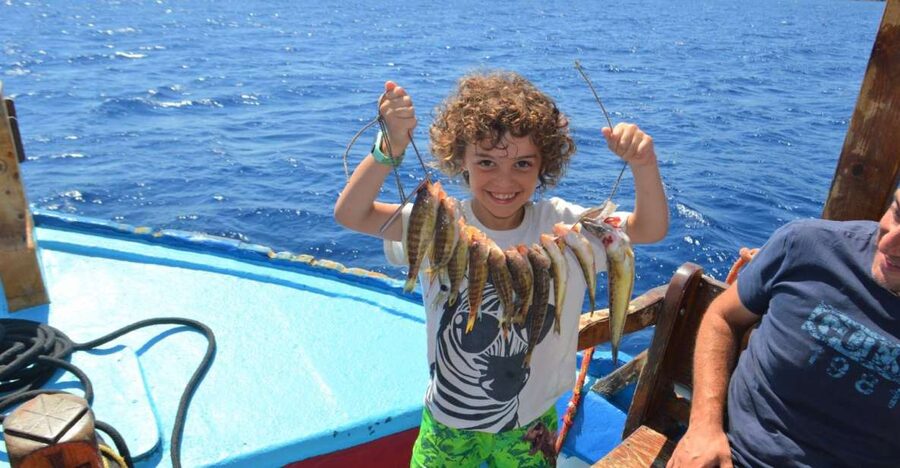 Rhodes Town: Fishing Boat Trip with Fish Meal and Swim Stops - Setting out from Mandraki Harbor