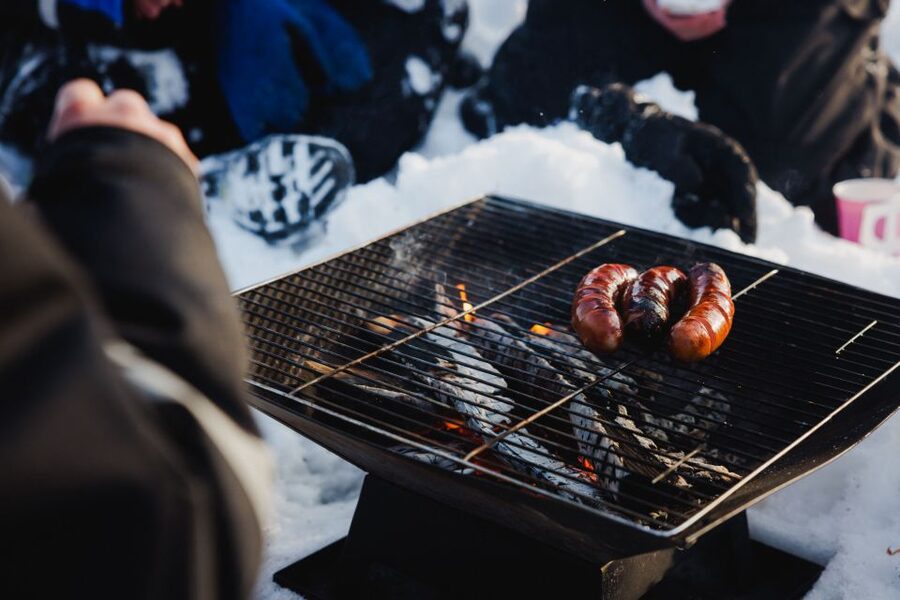 Rovaniemi: Arctic Circle Ice Fishing Experience - The campfire is more than a snack stop