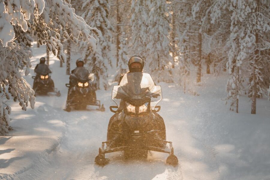 Rovaniemi: Electric Snowmobile Safari Tour with Ice Fishing - Learning to fish through the ice