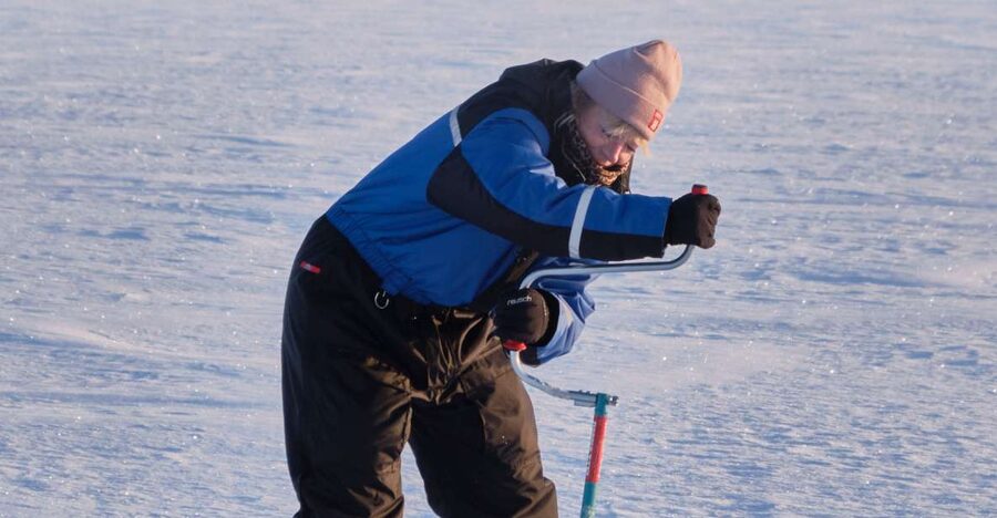 Rovaniemi: Ice-Fishing like a Finn - Fire, reindeer skins, and the waiting game