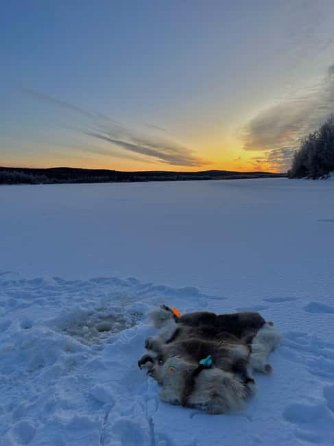 Rovaniemi: Ice Fishing The Finnish Way - Drilling through the frozen Ounasjoki River
