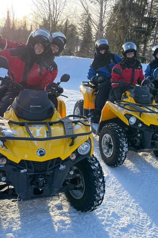 Rovaniemi: Quad Bike Ride and Ice Fishing - Drilling through the frozen lake
