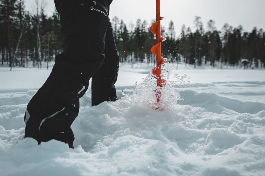 Saariselkä: Arctic Ice Fishing Experience - Learning to work through the ice