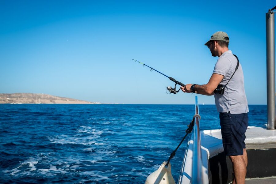 Santorini Sunset Fishing Trip with Dinner and Drinks - Trying the hand lines yourself