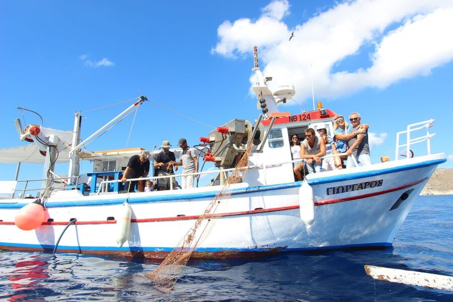 Santorini Sunset Fishing Trip with Dinner and Drinks - Swimming and snorkeling in the Aegean