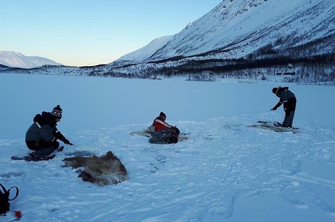 Sjursnes Arctic Ice Fishing Adventure from Tromso - Reindeer hides, hot drinks, and the cold