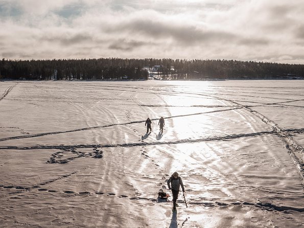 Snowshoeing and Ice Fishing Tour - Sausages, snacks, and a fire by the lake