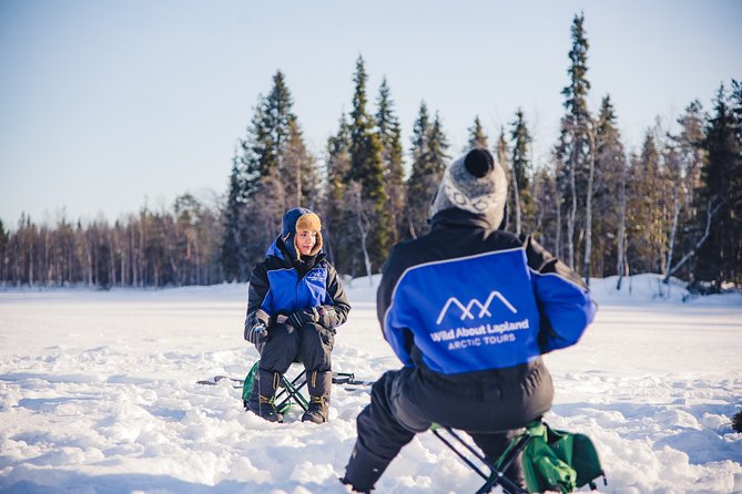 Snowshoeing and Ice Fishing Tour - Drilling through a frozen lake